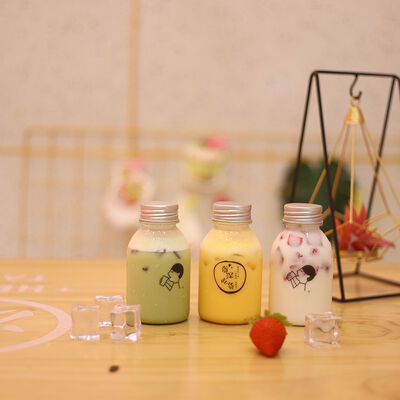 زجاجات الشاي من البلاستيك مع مقبض ومسمار على الغطاء حلول تعبئة المشروبات مع التعامل المريح